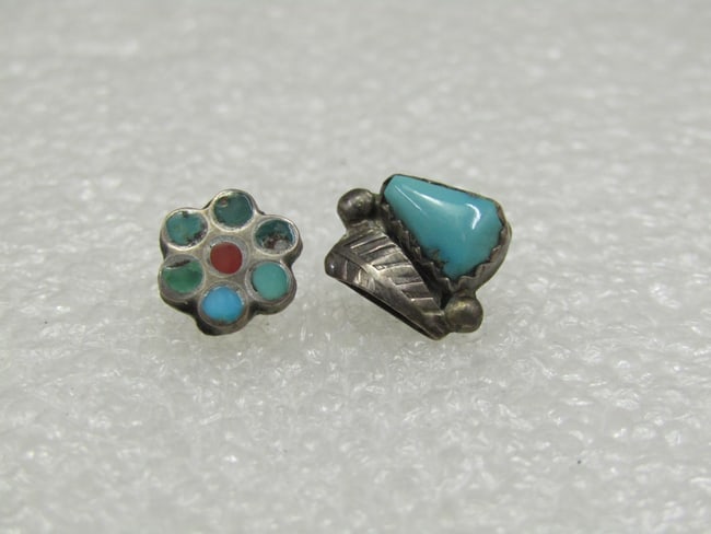 Vintage Sterling Southwestern Single Turquoise Earrings, 2 Pcs.: Vintage Sterling Southwestern Single Turquoise Earrings, 2 Pcs. Pierced earrings, appx. 1.26 grams. One is a nugget with feather accents and appx. 3/8" tall adn wide and the other is a blossom inlaid