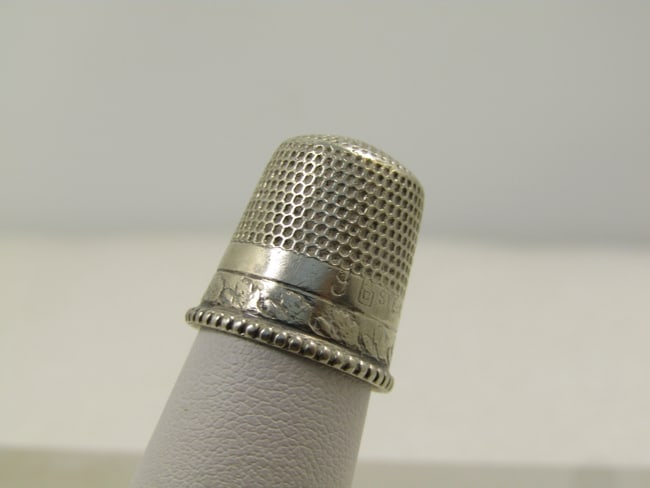 Vintage Sterling Thimble, Sz. 9, Signed B, 192o's-1940's: Vintage Sterling Thimble, Sz. 9, Signed B, 192o's-1940's. This has a slightly wider band supporting the opening of the thimble with a ribbed design and above that is a wide smooth band with the lower
