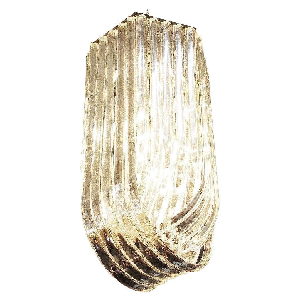 Large MCM Hollywood Regency Sculptural Lucite & Gold Tone Loop Ribbon Chandelier: Title: Large MCM Hollywood Regency Sculptural Lucite & Gold Tone Loop Ribbon Chandelier Description: Large mid-century Hollywood Regency Modern sculptural Lucite loop chandelier is comprised of three