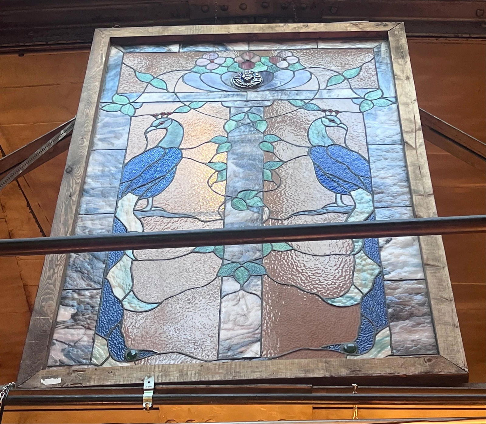 Vintage Peacock Design Stained Glass Window: Title: Vintage Peacock Design Stained Glass Window Description: Vintage Peacock Design Stained Glass Window This window pane depicts two blue and green peacocks perched on branches. Behind them,