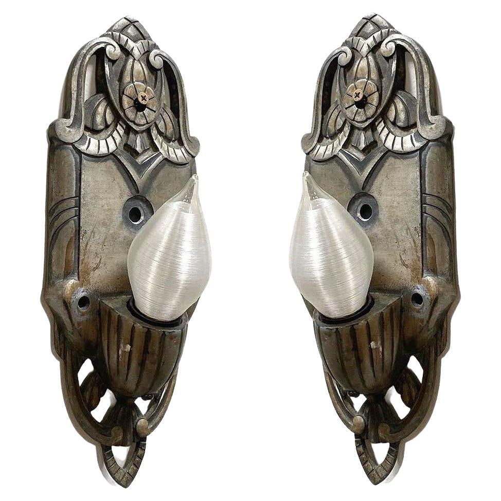 Early Art Decco Machined Aluminum Wall Sconce, Pair: Title: Early Art Decco Machined Aluminum Wall Sconce, Pair Description: Pair of early art deco machined aluminum wall sconces with graceful curves and geometric lines with a floral motifs in the cente