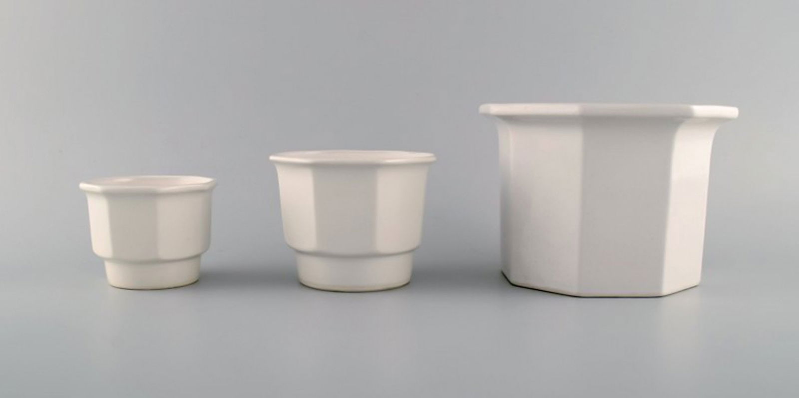 Gustavsberg, Sweden. Three flower pot covers in white glazed stoneware. 1970s.: Title: Gustavsberg, Sweden. Three flower pot covers in white glazed stoneware. 1970s. Description: Gustavsberg, Sweden. Three flower pot covers in white glazed stoneware. 1970s. Largest measures: 16.5