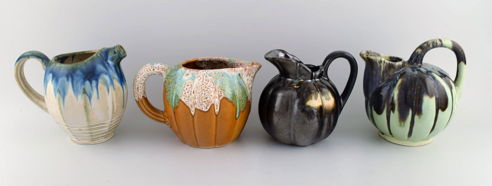 Four retro jugs in glazed ceramics. Beautiful glazes and shapes. Belgium, 1960s / 70s. - 2