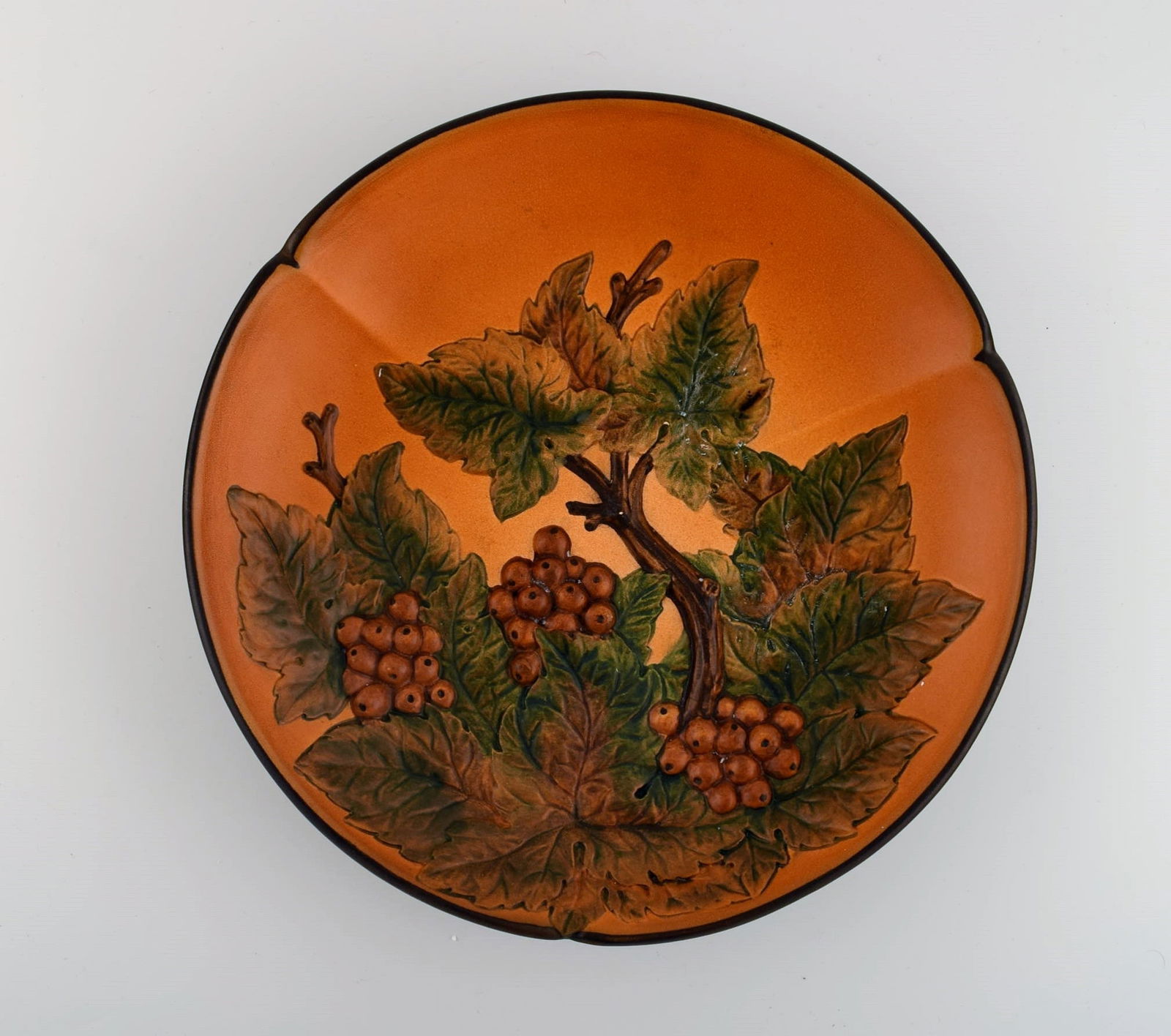 Ipsen's, Denmark. Circular dish with berries and foliage in hand-painted glazed ceramics. Model - 2
