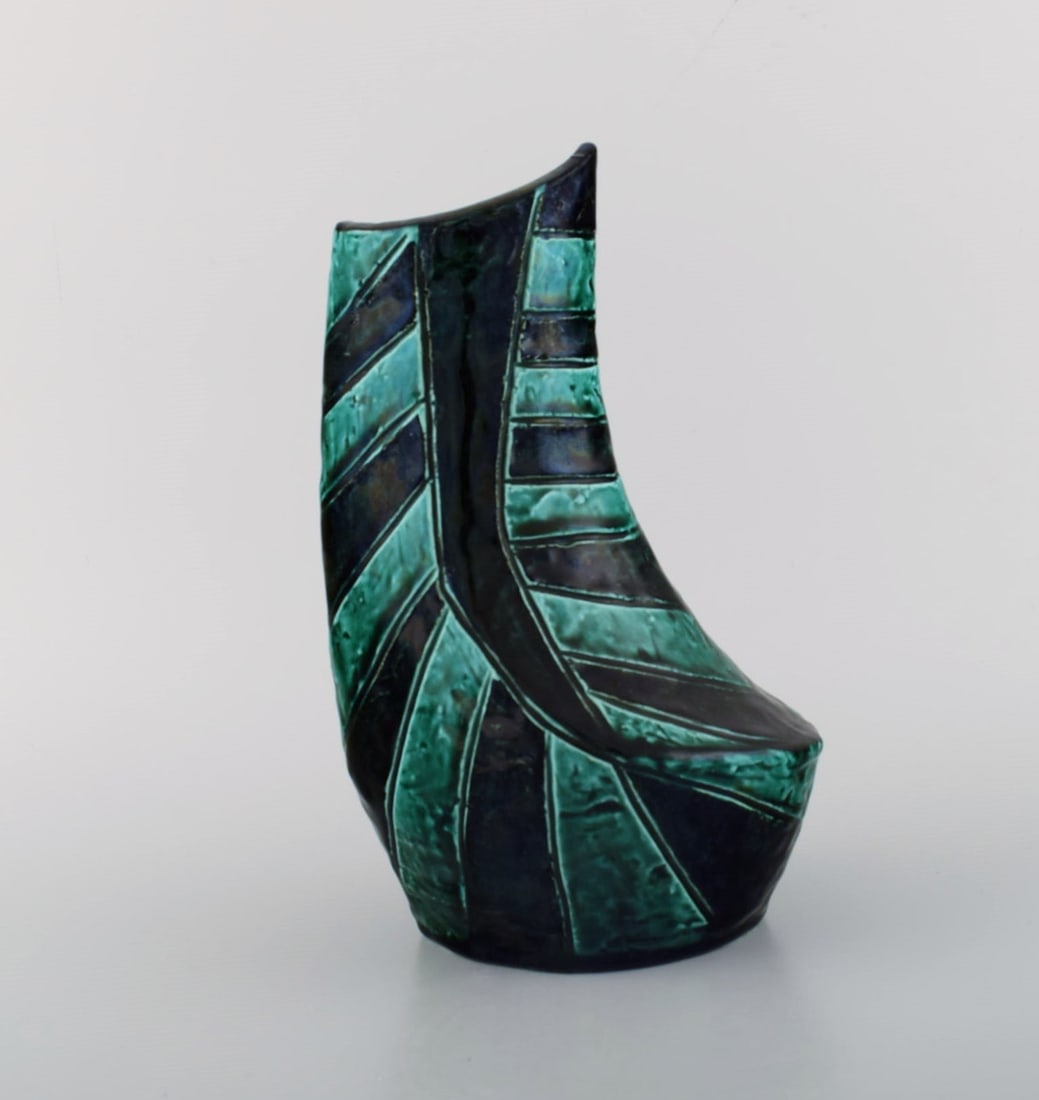 European studio ceramicist. Unique vase in glazed ceramics. Beautiful glaze in shades of blue and: Title: European studio ceramicist. Unique vase in glazed ceramics. Beautiful glaze in shades of blue and green. Striped design, 1960s / 70s. Description: European studio ceramicist. Unique vase in gla