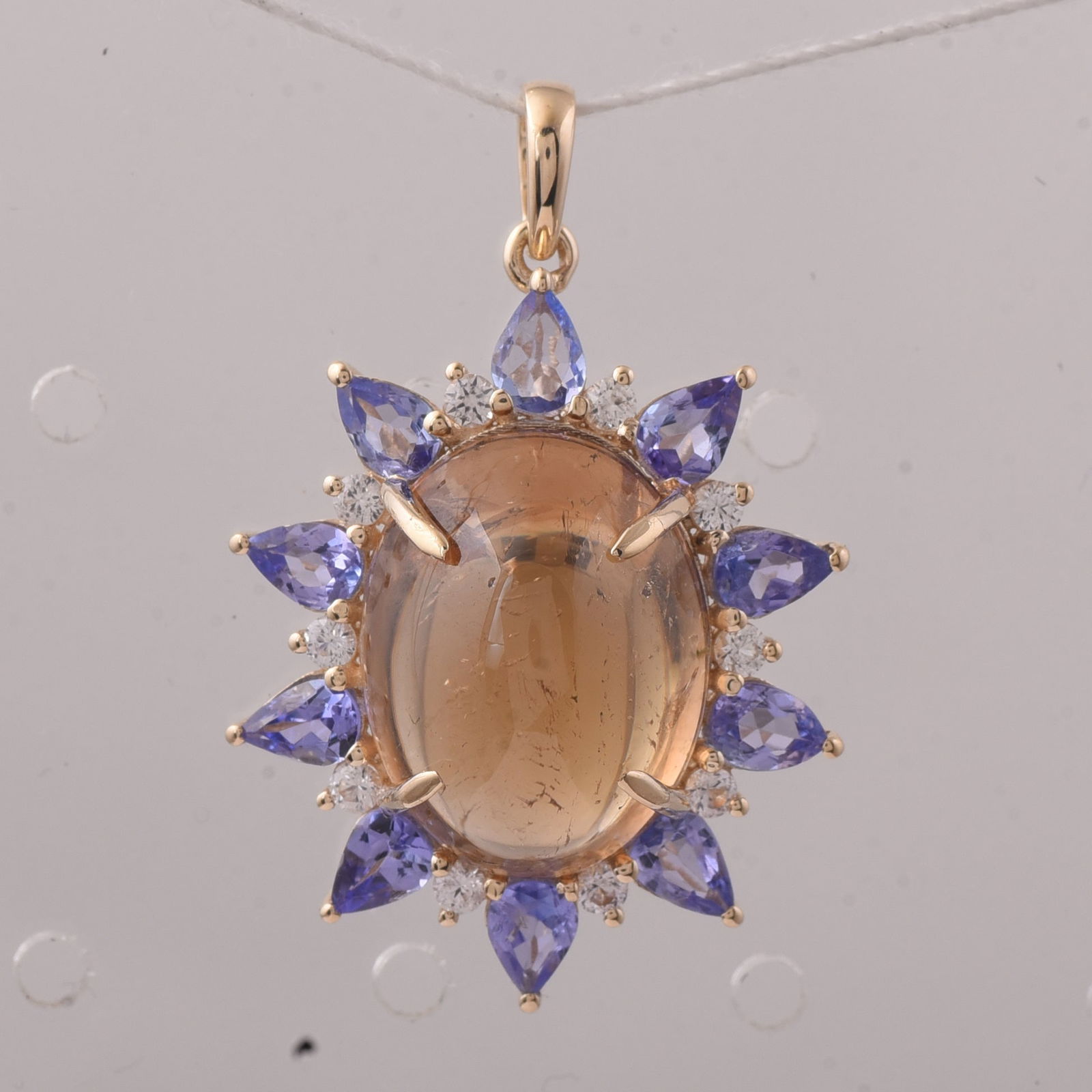 11.37 Ct Oval Tourmaline 9K Gold Pendant: 11.37 Total Carat Tourmaline 9K Gold Pendant Specifications - Total Weight 3.926 g - Center Gemstone Tourmaline - Gemstone Carat Weight 9.9 Carats - Gemstone Measurements 14.60X11.20X8.40 mm - Additio