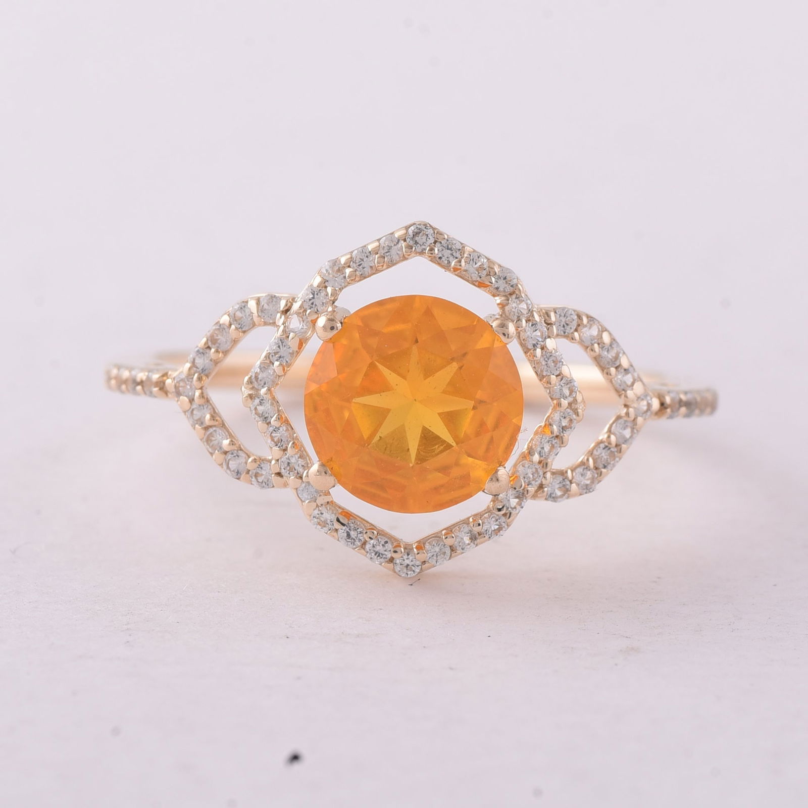 1.03 Ct Round Br.Opal 9K Gold Ring: 1.03 Total Carat Br.Opal 9K Gold Ring Specifications - Total Weight 1.74 g - Center Gemstone Br.Opal - Gemstone Carat Weight 0.8 Carats - Gemstone Measurements 7 mm - Additional Gemstones White Sapphi