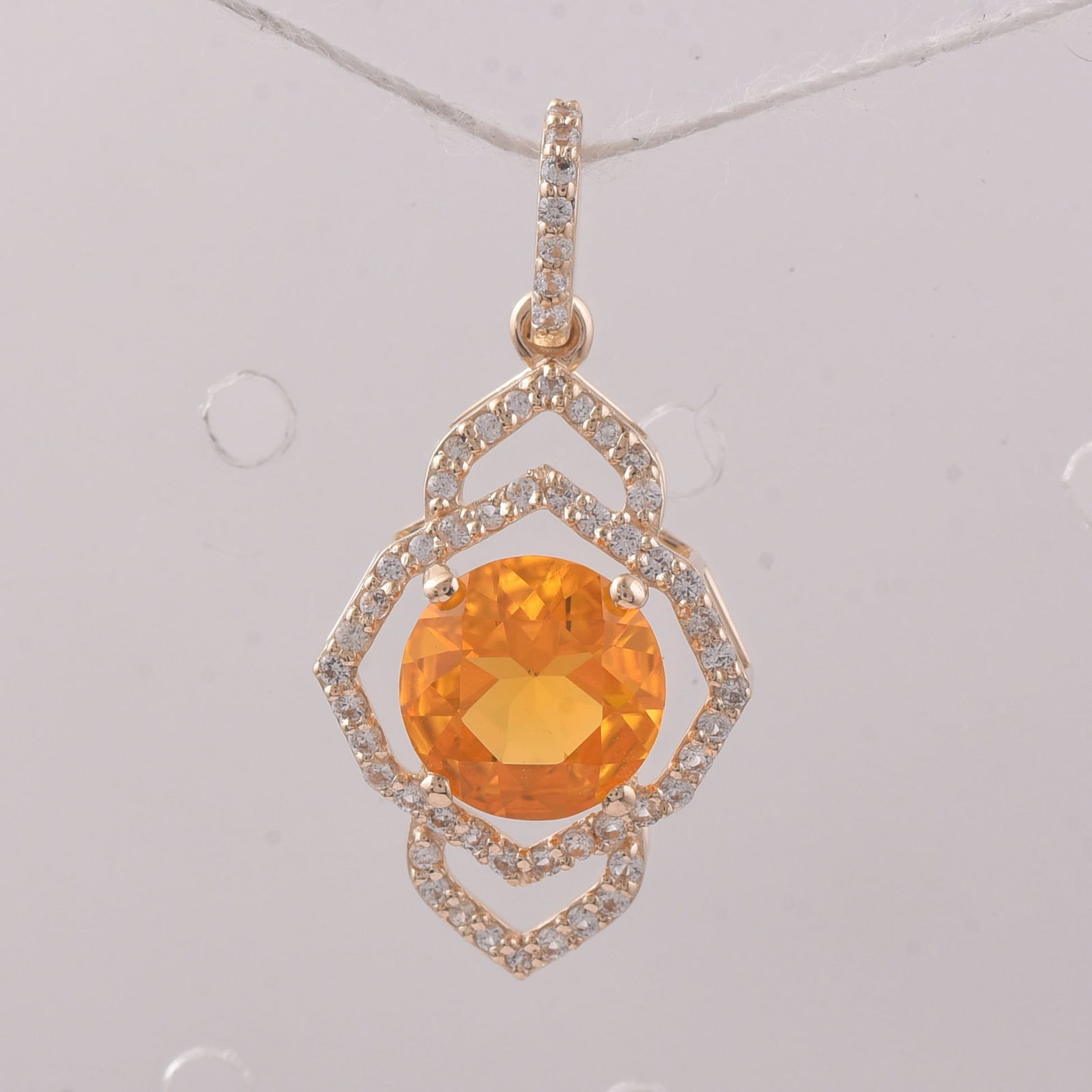 1.04 Ct Round Br.Opal 9K Gold Pendant: 1.04 Total Carat Br.Opal 9K Gold Pendant Specifications - Total Weight 1.085 g - Center Gemstone Br.Opal - Gemstone Carat Weight 0.81 Carats - Gemstone Measurements 7 mm - Additional Gemstones White S