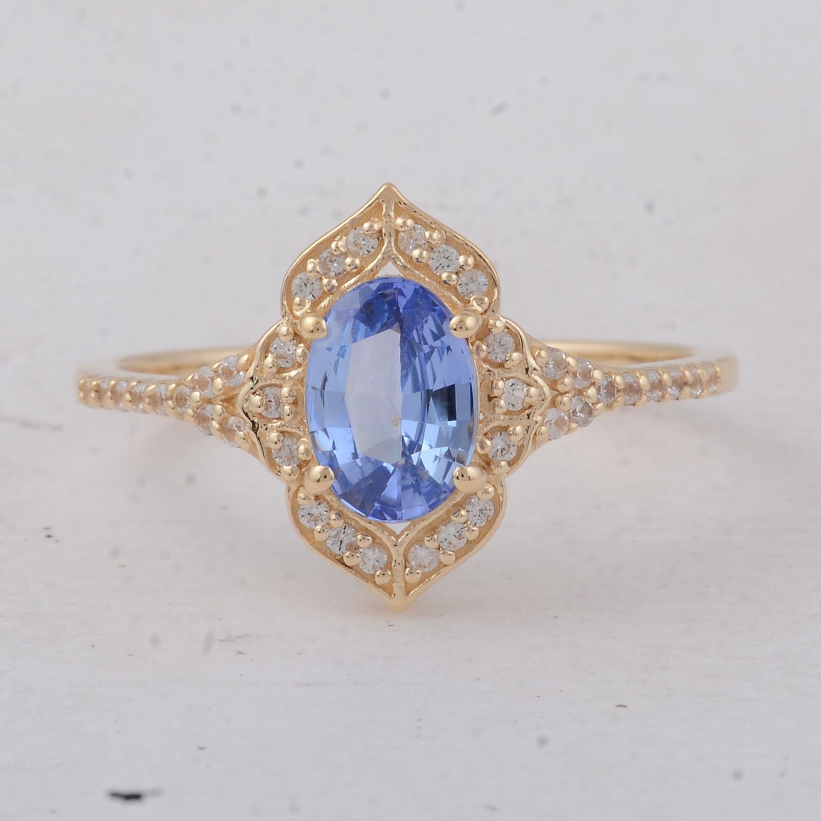 1.13 Ct Oval Sapphire 9K Gold Ring: 1.13 Total Carat Sapphire 9K Gold Ring Specifications - Total Weight 1.81 g - Center Gemstone Sapphire - Gemstone Carat Weight 0.98 Carats - Gemstone Measurements 7.10X5X3 mm - Additional Gemstones Wh