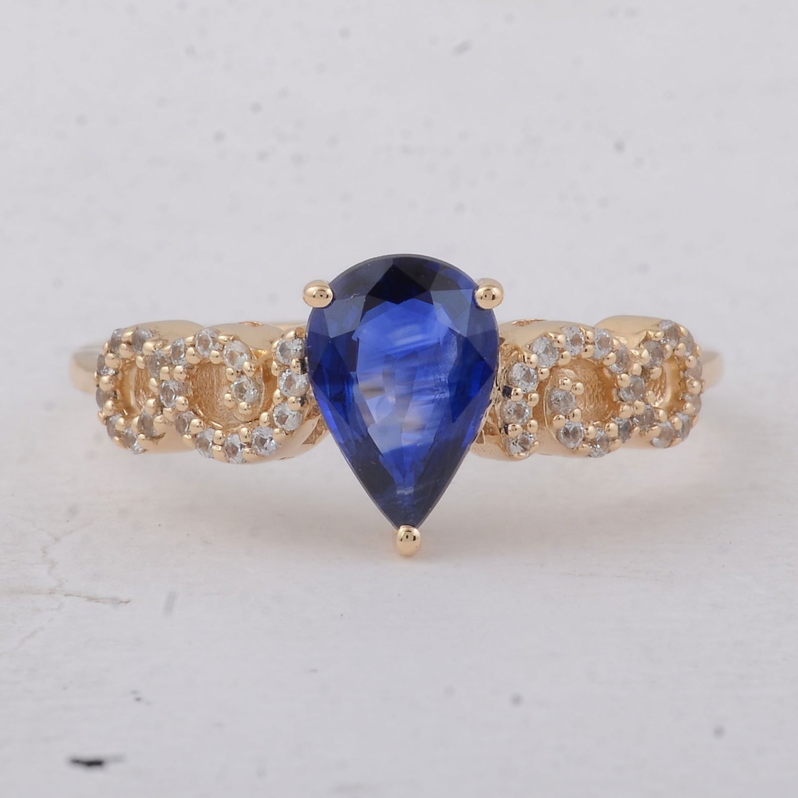1.32 Ct Pear Sapphire 9K Gold Ring: 1.32 Total Carat Sapphire 9K Gold Ring Specifications - Total Weight 2.21 g - Center Gemstone Sapphire - Gemstone Carat Weight 1.16 Carats - Gemstone Measurements 8.50X5.90X2.80 mm - Additional Gemsto