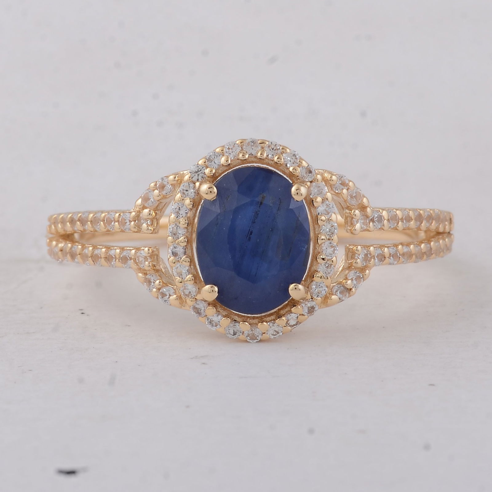 1.39 Ct Oval Emerald 9K Gold Ring: 1.39 Total Carat Blue Sapphire 9K Gold Ring Specifications - Total Weight 2.06 g - Center Gemstone Blue Sapphire - Gemstone Carat Weight 1.09 Carats - Gemstone Measurements 7.40X5.70X3 mm - Additional