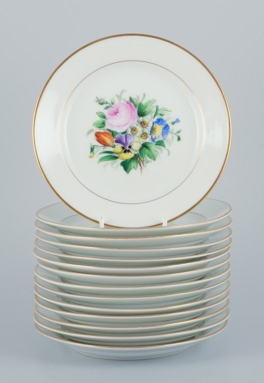 Bing & Grondahl, a set of fourteen plates hand-painted with various polychrome flower motifs and (1 of 9)