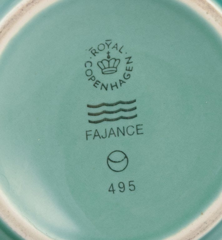 Royal Copenhagen, 4 All Seasons, four coffee mugs and a small oval dish in faience with green glaze. - 4