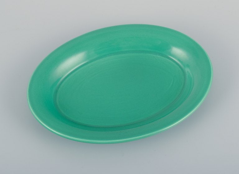 Royal Copenhagen, 4 All Seasons, four coffee mugs and a small oval dish in faience with green glaze. - 5