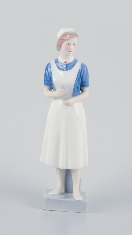 Royal Copenhagen, rare porcelain figurine of a nurse. (1 of 7)