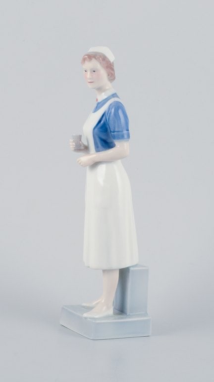 Royal Copenhagen, rare porcelain figurine of a nurse. - 3