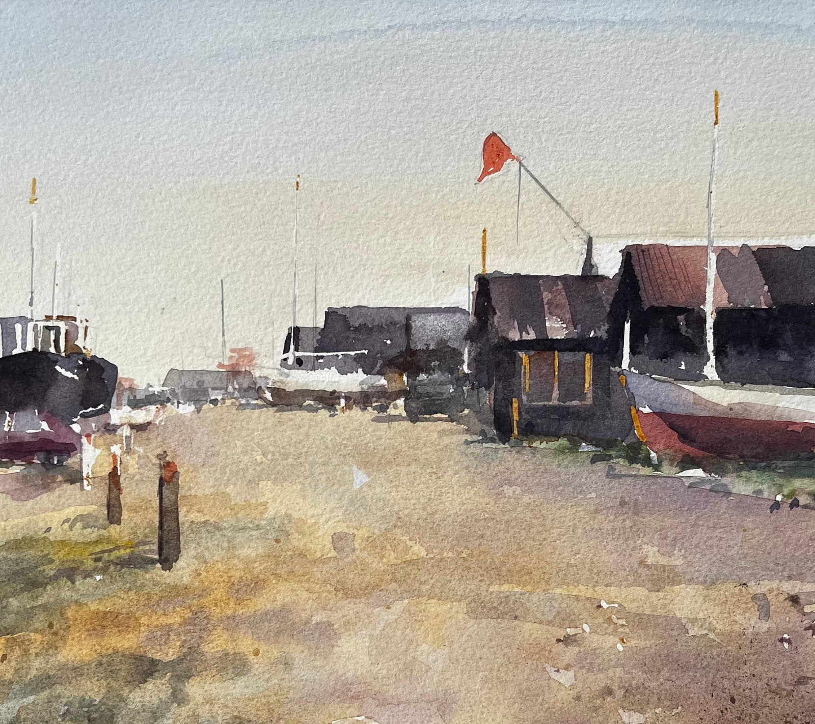 Anthony Herbert; Coastal Boatyard with Fishing Huts Beached Boats and Red Flag Watercolour Scene - 7