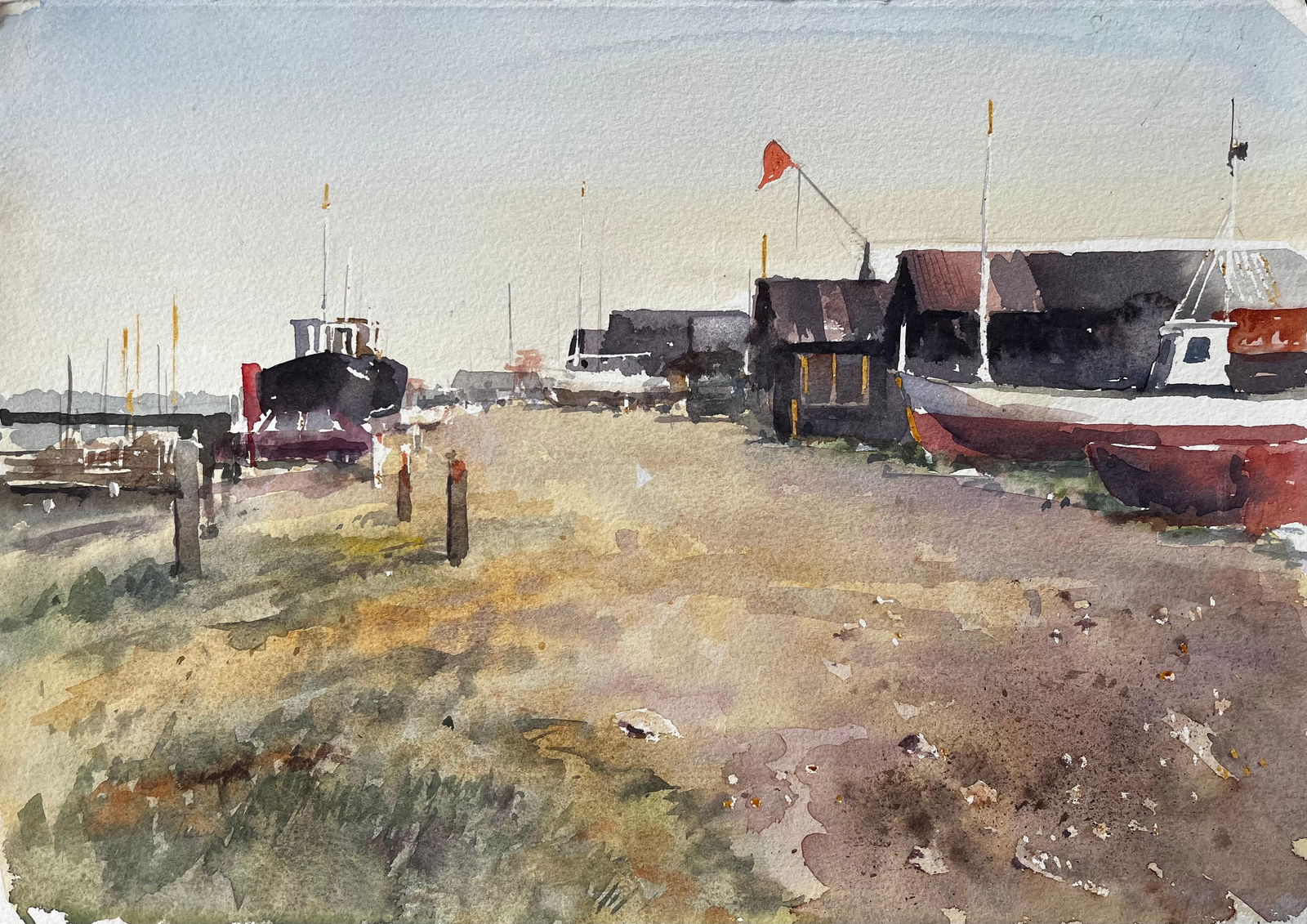 Anthony Herbert; Coastal Boatyard with Fishing Huts Beached Boats and Red Flag Watercolour Scene - 4