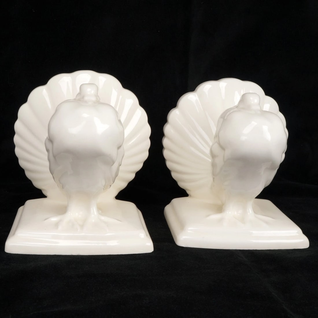 Pair 1930s Czech Erphila Pigeon Bookends: Title:Pair 1930s Czech Erphila Pigeon BookendsSize:5 ¼ in (13.3 cm) wide x 4 ¼ in (10.8 cm) deep x 5 ¾ in (14.6 cm) tall.Description:A molded pair of ceramic bookends in the