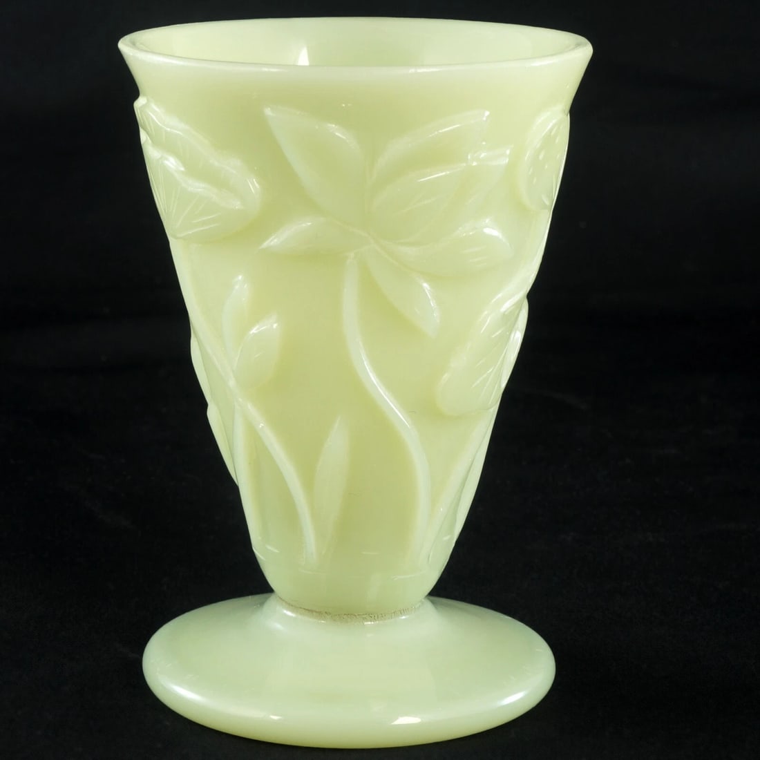 Peking Glass Lotus Wine Cup Jade Color c 1920: Title:Peking Glass Lotus Wine Cup Jade Color c 1920Size:2 3/8 in (5.9 cm) diameter x 3 3/8 in (8.4 cm) tall.Description:A molded light green Peking glass wine cup with lotus flowers and seed heads