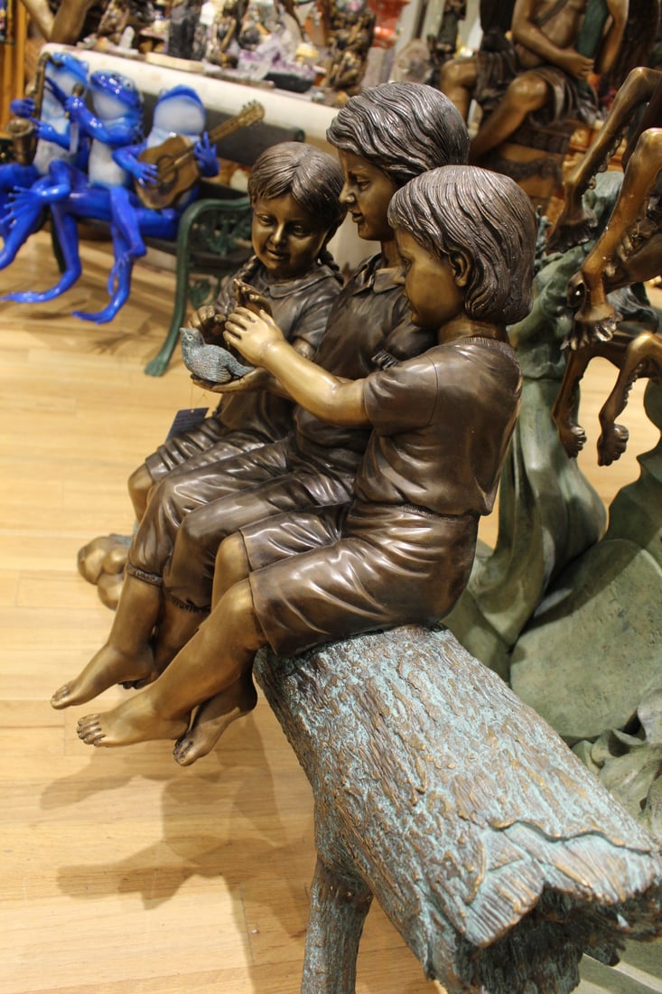 Three Children On Log Holding Bird Bronze Statue - Size: 55"L x 18"W x 38"H. - 6