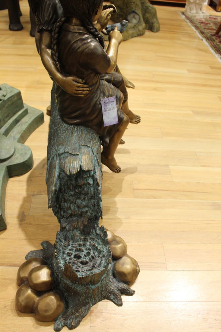 Three Children On Log Holding Bird Bronze Statue - Size: 55"L x 18"W x 38"H. - 9