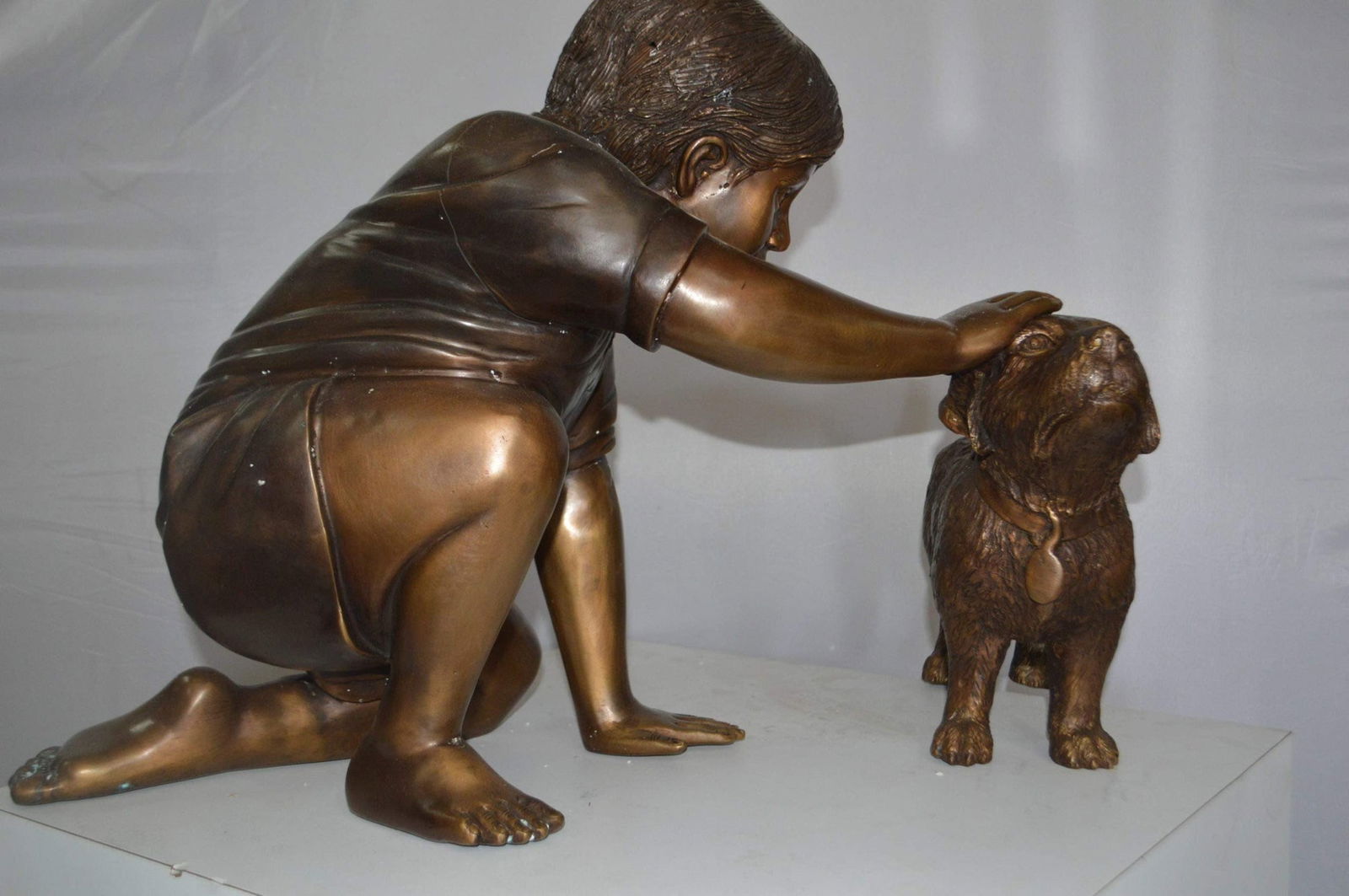 Boy and Dog Bronze Statue - Size: 30"L x 18"W x 18"H. - 10
