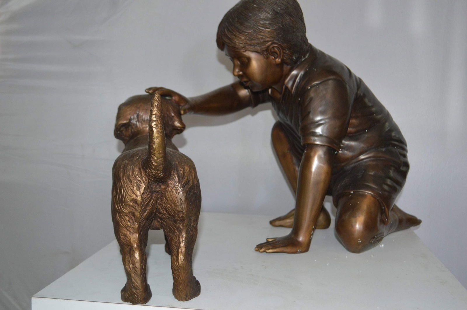 Boy and Dog Bronze Statue - Size: 30"L x 18"W x 18"H. - 3