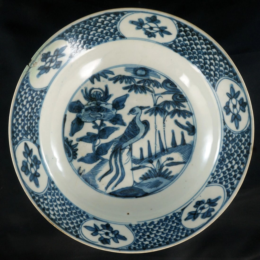 Large Chinese Wanli Ming Phoenix Bowl: Title:Large Chinese Wanli Ming Phoenix BowlSize:11 in (27.9 cm) diameter x 2 ¼ in (5.7 cm) tall.Description:A very old Chinese shallow blue and white bowl with that deep Wanli blue cobalt. I