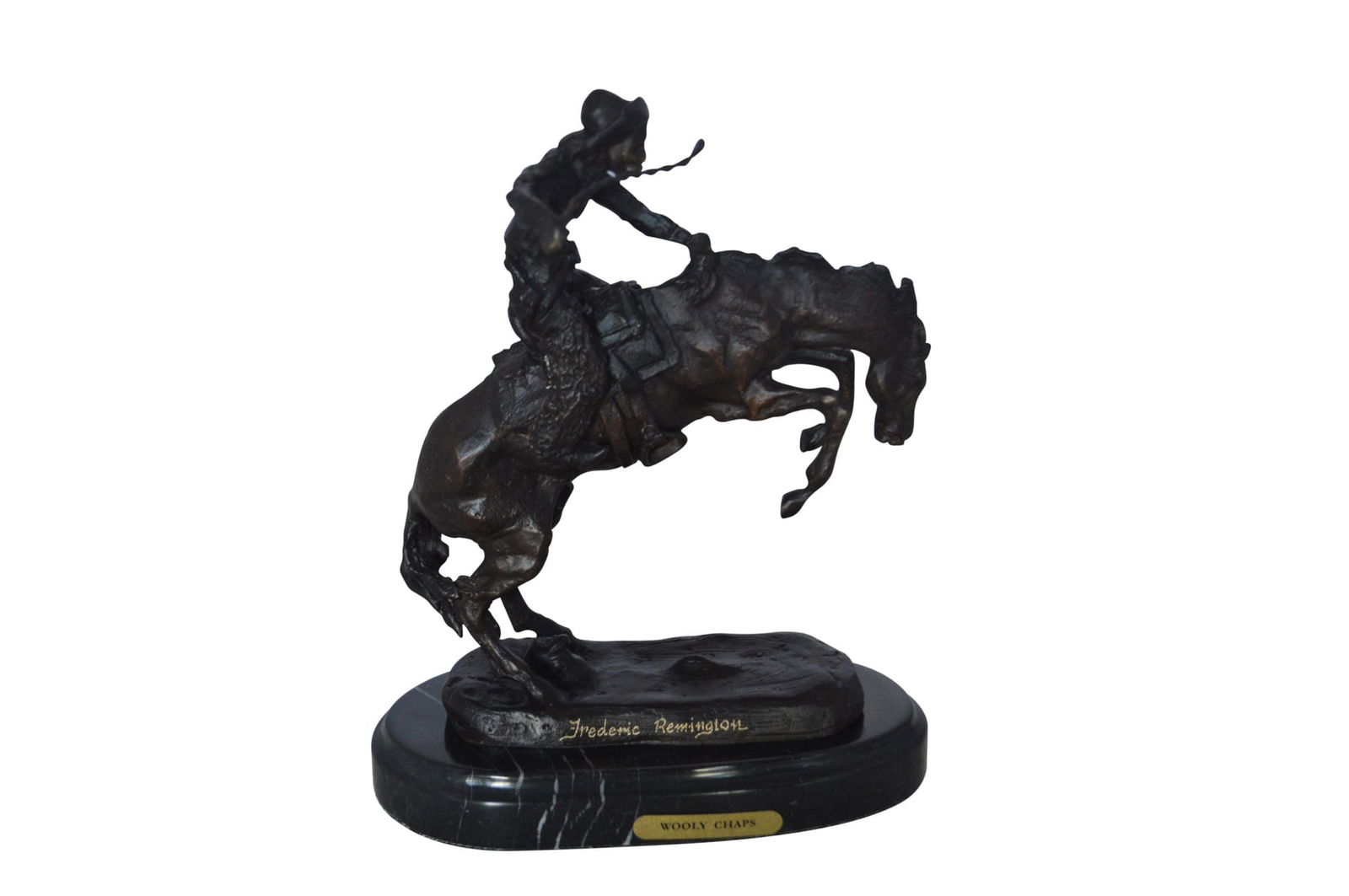 Wooly Chaps Bronze Statue by Remington 13H - Size: 8"L x 3"W x 9"H.: Title:Wooly Chaps Bronze Statue by Remington 13H - Size: 8"L x 3"W x 9"H.Description:Frederic Remington Wooly Chaps, is a variation of his most famous sculpture, The Bronco Buster. The difference in