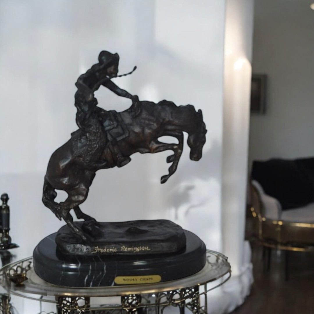 Wooly Chaps Bronze Statue by Remington 13H - Size: 8"L x 3"W x 9"H. - 2