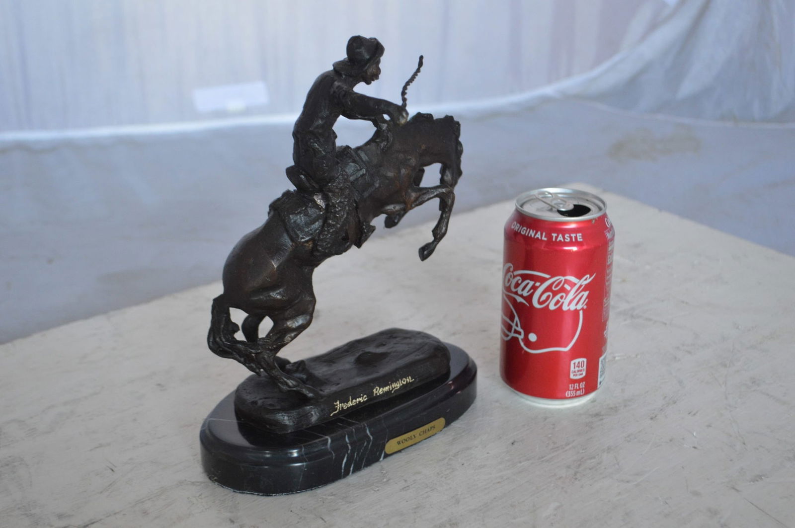 Wooly Chaps Bronze Statue by Remington 13H - Size: 8"L x 3"W x 9"H. - 5