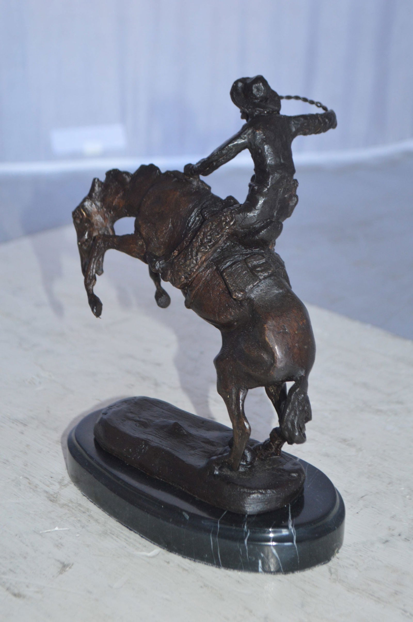 Wooly Chaps Bronze Statue by Remington 13H - Size: 8"L x 3"W x 9"H. - 8