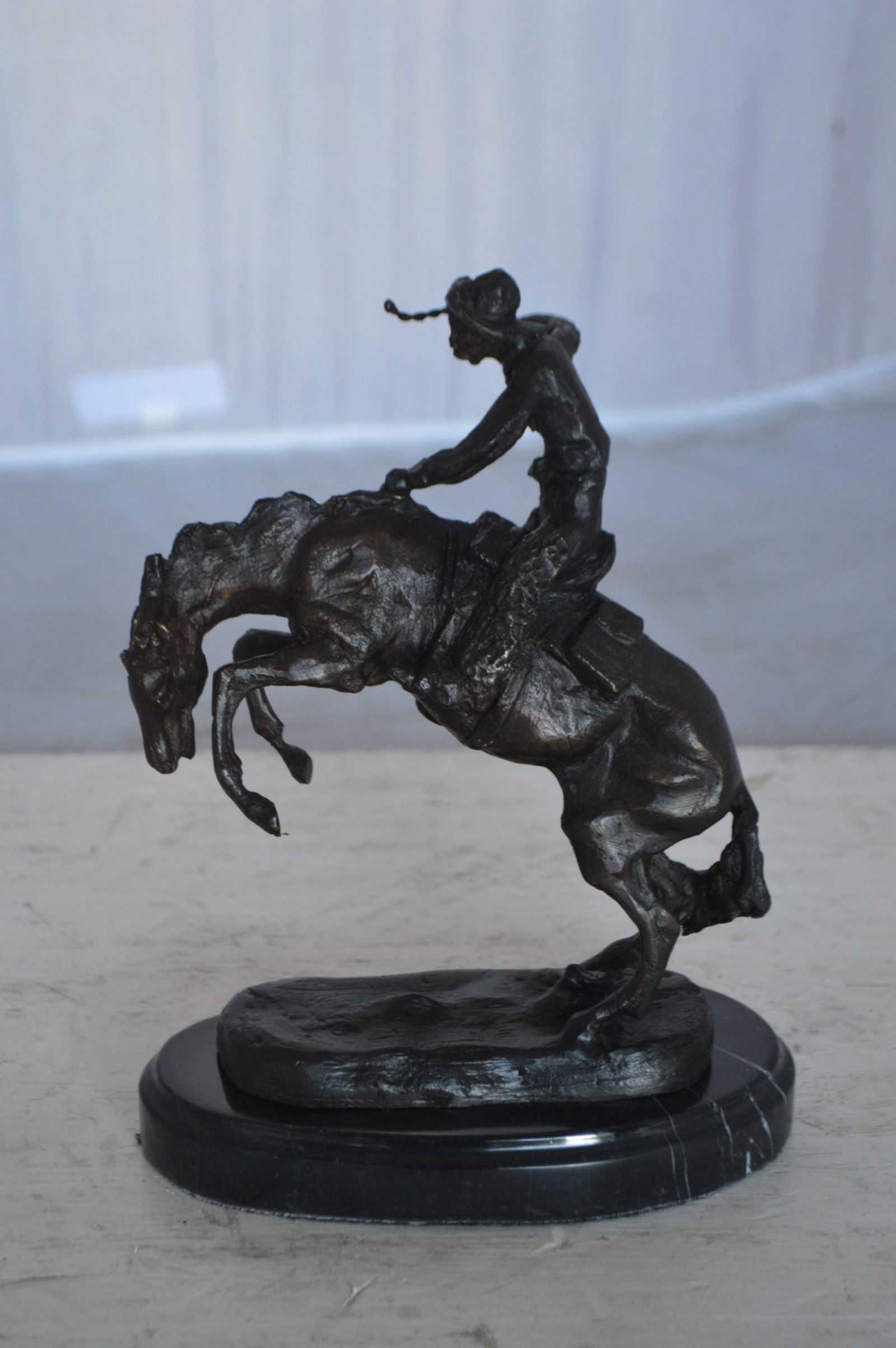 Wooly Chaps Bronze Statue by Remington 13H - Size: 8"L x 3"W x 9"H. - 9