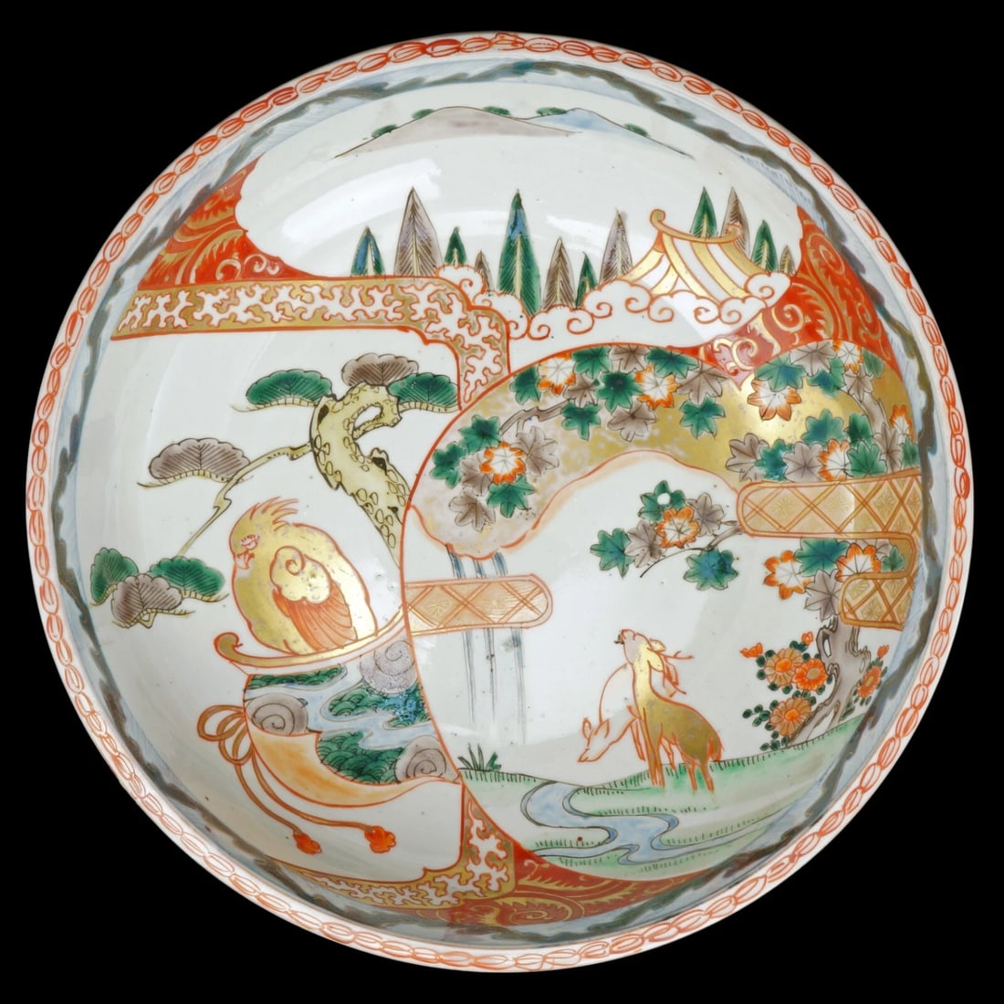 19th C Large Japanese Imari Bowl: Title:19th C Large Japanese Imari BowlSize:9 7/8 in (25.1 cm) diameter x 3 1/8 in (7.9 cm) tall.Description:A large and colorful hand painted bowl with designs of a parrot, deer, mountains, maple