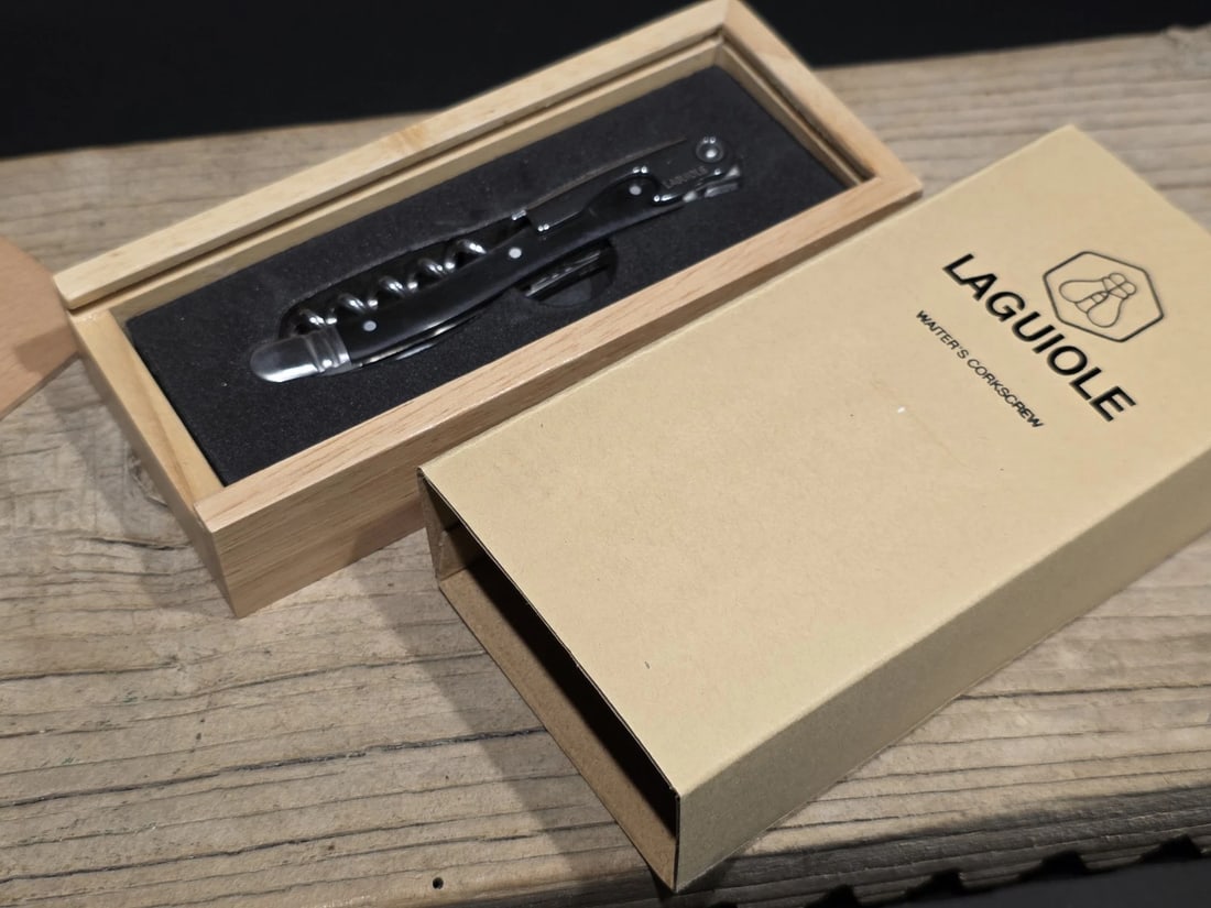 Laguiole Corkscrew with Black Horn Handles: 4 1/2" long x 5/8" Wide Nice quality, brand new, never used heavy waiters style Laguiole corkscrew with bovine ox horn handles, stainless steel. The corkscrew features a ribbed worm for steady cork re