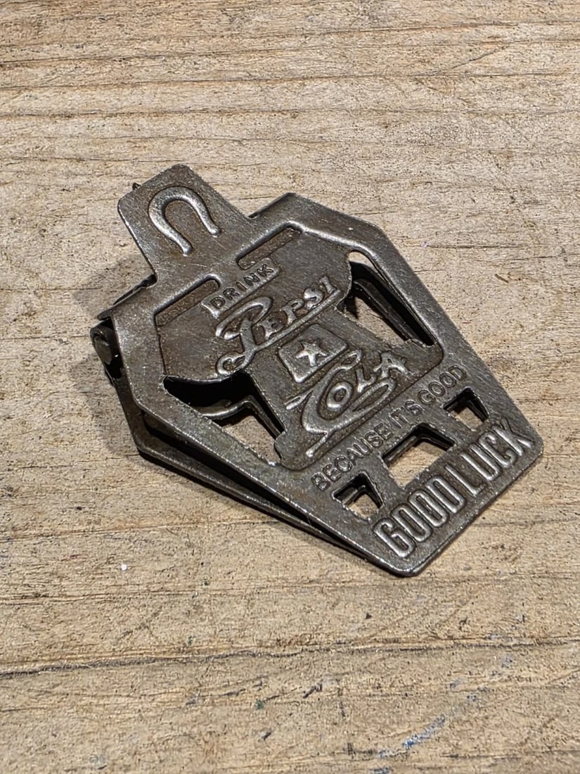 Metal Pepsi Cola Good Luck Paper or Money Clip: Reproduction Pepsi-Cola “Good Luck” Advertising Clip This solid metal reproduction Pepsi-Cola Good Luck clip is inspired by early 20th-century promotional novelties produced during the for