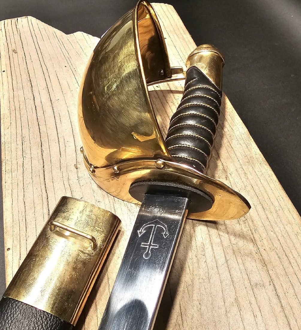 1860 US Naval Cutlass Heavy Calvary Saber Sword: The reproduction 1860 naval cutlass sword is a meticulously crafted piece that captures the essence of 19th-century naval weaponry. Measuring 36 inches overall, including the scabbard, and 33.25