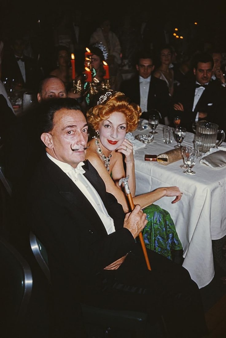 Slim Aarons 'Dali's Party' 1959 Official Limited Estate Edition: 1959 (Printed Later): Title: Slim Aarons 'Dali's Party' 1959 Official Limited Estate Edition: 1959 (Printed Later) Description: Dali's Party' circa 1959: Surrealist painter Salvador Dali (1904 - 1989) with a red-haired