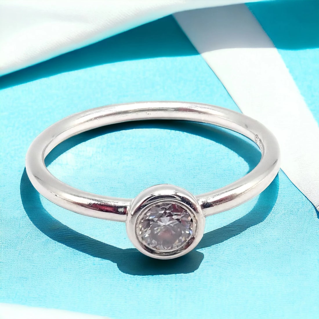 Tiffany & Co Platinum 0.12ct Diamond Engagement Stacking Ring size 6.5: Tiffany & Co Platinum 0.12ct Diamond Engagement Stacking Ring size 6.5 About This Piece: This Tiffany & Co. engagement stacking ring, sized 6.5, is exquisitely crafted from platinum and features a 0.1