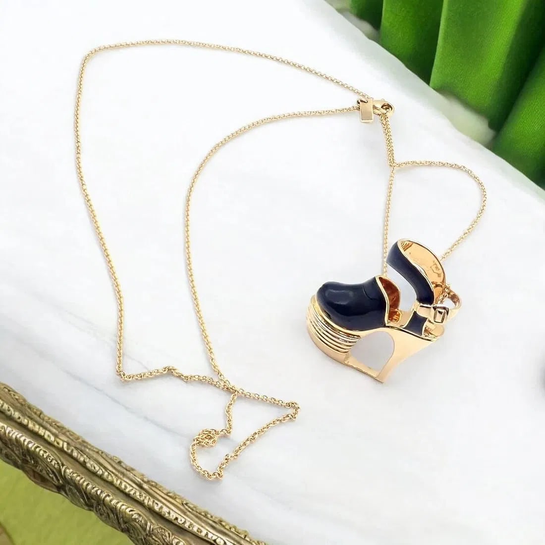 Authentic! Salvatore Ferragamo 18K Yellow Gold Enamel Shoe Pendant Necklace: Authentic! Salvatore Ferragamo 18K Yellow Gold Enamel Shoe Pendant Necklace About This Piece: The Salvatore Ferragamo pendant necklace features a charming shoe design crafted from 18k yellow gold, acc