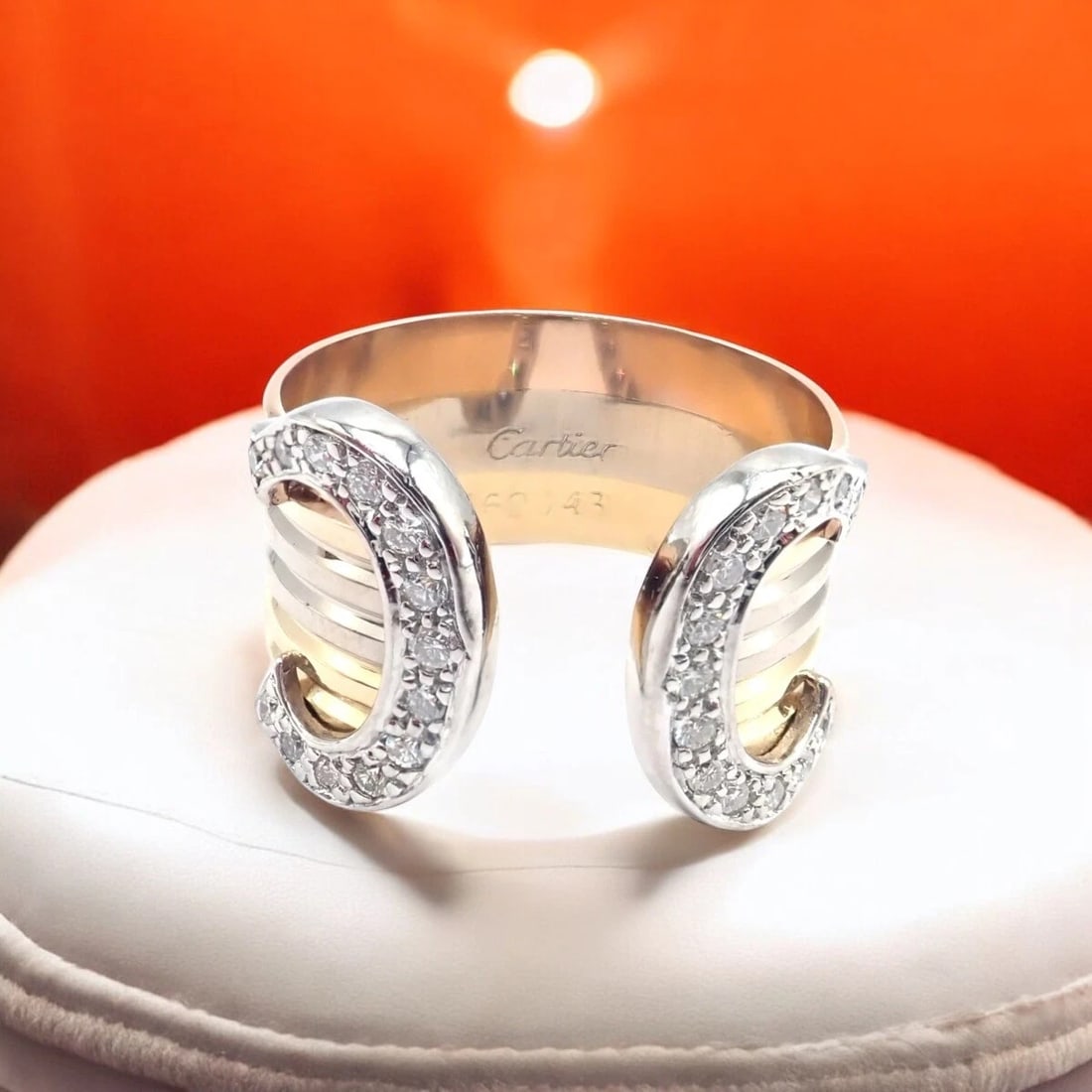 Authentic! Cartier Diamond Double C 18k Tri-Color Gold Band Ring Size 53 US 6.25: Authentic! Cartier Diamond Double C 18k Tri-Color Gold Band Ring Size 53 US 6.25 About This Piece: The Cartier Diamond Double C 18k Tri-Color Gold Band Ring showcases a blend of yellow, white, and ros