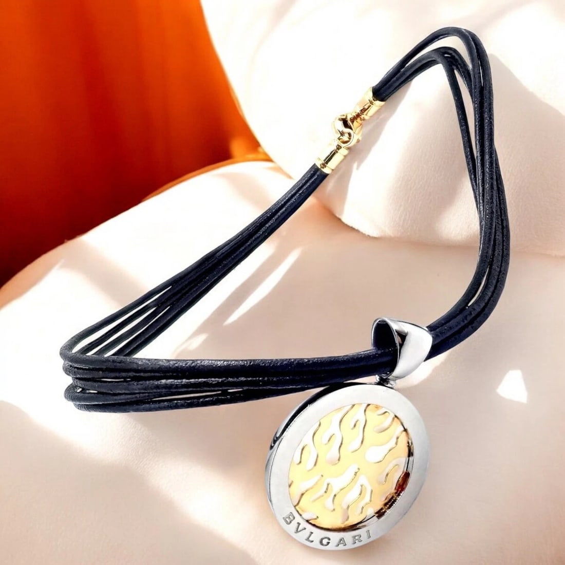 Authentic! Bulgari Tondo Fire 18k Yellow Gold & Stainless Steel Pendant Necklace: Authentic! Bulgari Tondo Fire 18k Yellow Gold & Stainless Steel Pendant Necklace About This Piece: The Bulgari Tondo Fire Pendant Necklace features a striking combination of 18k yellow gold and stainl