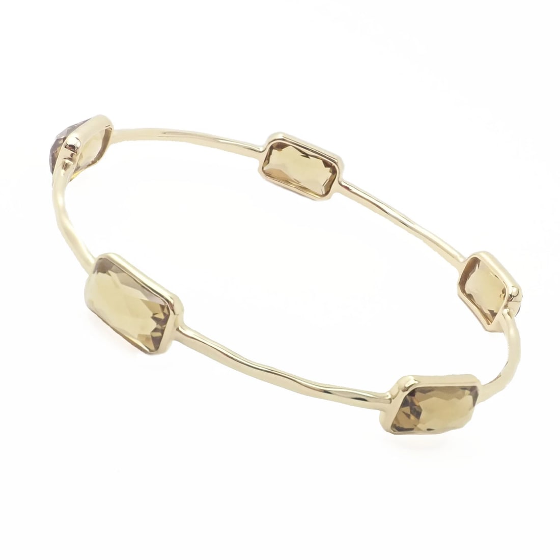 Authentic! Ippolita 18k Yellow Gold Rock Candy 5 Smoky Topaz Bangle Bracelet: Authentic! Ippolita 18k Yellow Gold Rock Candy 5 Smoky Topaz Bangle Bracelet About This Piece: Metal: 18k Yellow Gold Length: 7.5" Weight: 14.5 grams Stones: Smoky Topaz Stones 6.7mm x 12mm bezel set