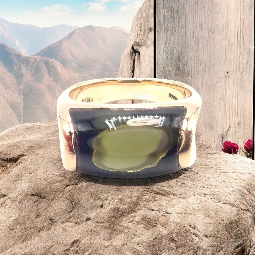 Authentic Bulgari Bvlgari Tronchetto 18k Yellow Gold Large Green Tourmaline Ring: Authentic Bulgari Bvlgari Tronchetto 18k Yellow Gold Large Green Tourmaline Ring About This Piece: Bulgari's Tronchetto 18k Yellow Gold Ring boasts an impressive large green tourmaline centerpiece, ra