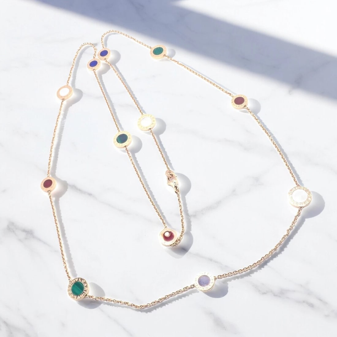 Authentic! Bvlgari Bulgari 18k Rose Gold Multi Gemstone 38" Long Necklace: Authentic! Bvlgari Bulgari 18k Rose Gold Multi Gemstone 38" Long Necklace About This Piece: The Bvlgari 18k Rose Gold Multi Gemstone Long Necklace is an authentic piece featuring a luxurious array of