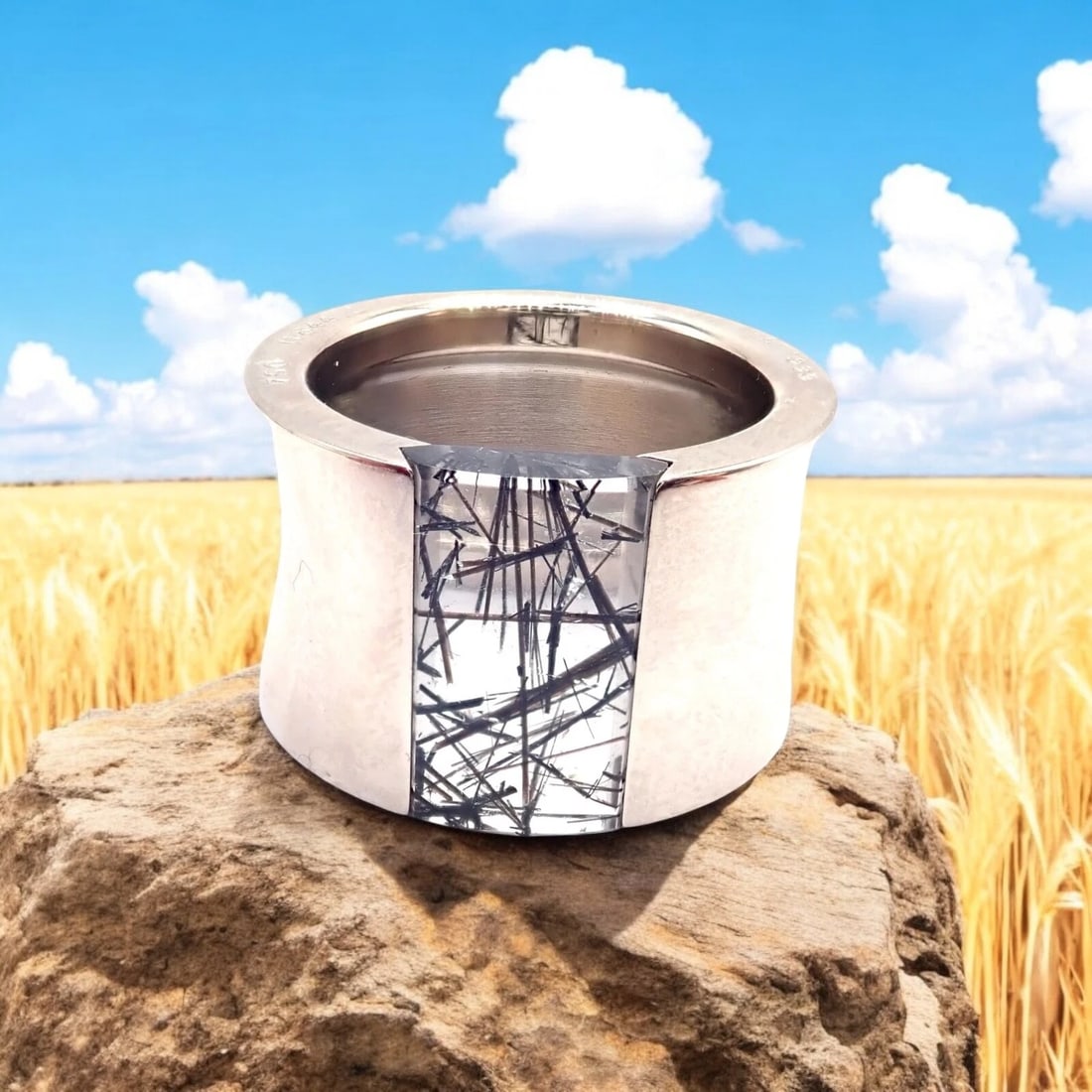 Authentic! Cartier 18k White Gold Rutilated Quartz Wide Band Ring Size 54: Authentic! Cartier 18k White Gold Rutilated Quartz Wide Band Ring Size 54 About This Piece: Exuding Cartier's refined elegance, this wide band ring, crafted in 18k white gold, showcases a captivating