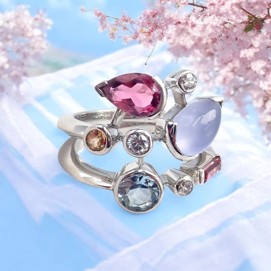 Authentic! Cartier Meli Melo Platinum Chalcedony Tourmaline Garnet Diamond Ring: Authentic! Cartier Meli Melo Platinum Chalcedony Tourmaline Garnet Diamond Ring About This Piece: The Cartier Meli Melo Platinum Ring is a masterpiece of elegance and artistry. Showcasing an eclectic