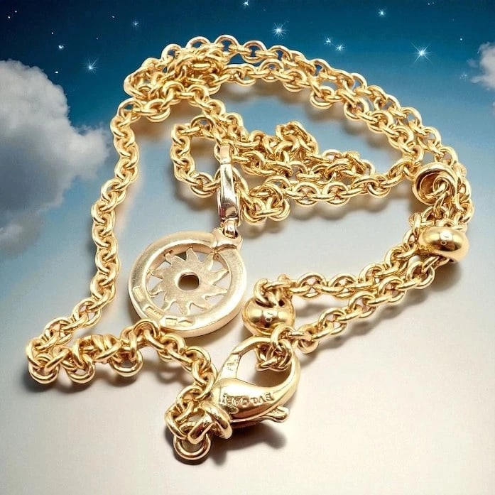 Authentic! Bvlgari Bulgari 18k Yellow Gold 19.5" Tondo Sun Pendant Necklace: Authentic! Bvlgari Bulgari 18k Yellow Gold 19.5" Tondo Sun Pendant Necklace About This Piece: Authentic Bvlgari Bulgari 18k yellow gold Tondo Sun pendant necklace, measuring 19.5 inches. Features a ra