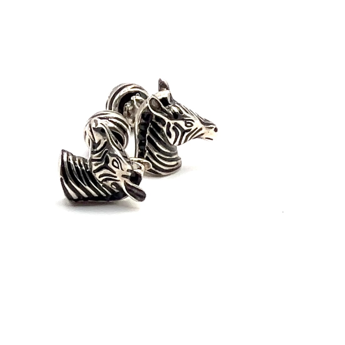 Vintage Tiffany & Co. Silver Black Enamel Zebra Cufflinks: Vintage Tiffany & Co. Silver Black Enamel Zebra Cufflinks About This Piece: The Vintage Tiffany & Co. Silver Black Enamel Zebra Cufflinks are a striking accessory. Crafted from sterling silver, these